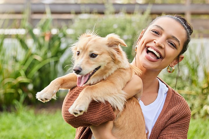happy dog with owner